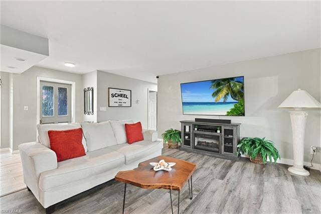 2816 18th Ave, Cape Coral, FL 33904 Wood-finish flooring throughout the space