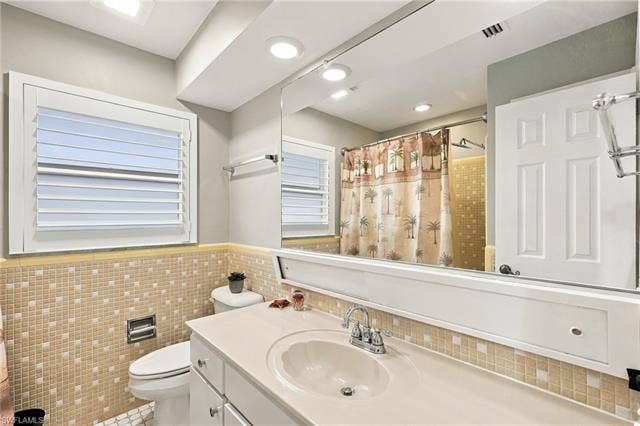2816 18th Ave, Cape Coral, FL 33904 Vanity with integrated sink, chrome faucet, and storage cabinetry