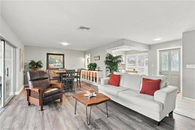 2816 18th Ave, Cape Coral, FL 33904 Wood-finish flooring throughout, with a recessed lighting fixture