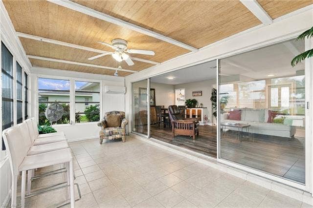 2816 18th Ave, Cape Coral, FL 33904 Sunroom with tiled flooring, wood-finish ceiling, and large sliding glass doors
