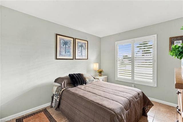 2816 18th Ave, Cape Coral, FL 33904 Plantation shutters, tile flooring, light neutral wall color, white trim, and a white ceiling