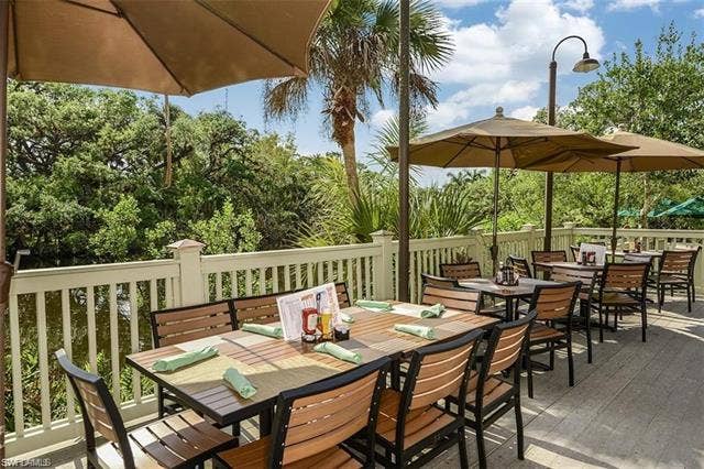 13491 Palmetto Grove Dr, Fort Myers, FL 33905 Outdoor Blossoms Bistro and Bar overlooking the Orange River. Kayak ramp too!