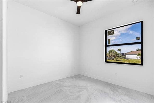 4116 36th Ln, Cape Coral, FL 33993 White walls, wood-finish ceiling fan, and large window