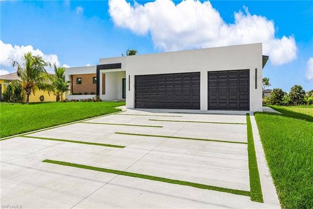 4116 36th Ln, Cape Coral, FL 33993 Modern exterior architecture with a flat roofline