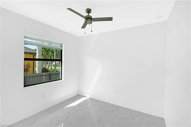 113 38 Pl, Cape Coral, FL 33993 White walls, modern ceiling fan, large window, tile flooring, recessed lighting