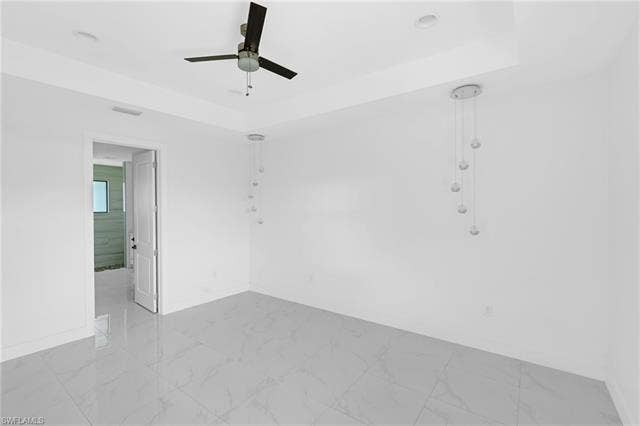 113 38 Pl, Cape Coral, FL 33993 Recessed lighting and a ceiling fan illuminate the space