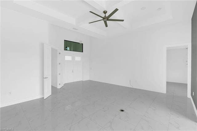 113 38 Pl, Cape Coral, FL 33993 Tray ceiling with a ceiling fan, white double entry doors with transom window, and large format tile flooring