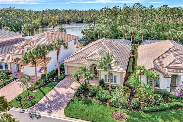 9375 Oak Strand Dr, Estero, FL 34135 Bird's eye view with a water view and a wooded view