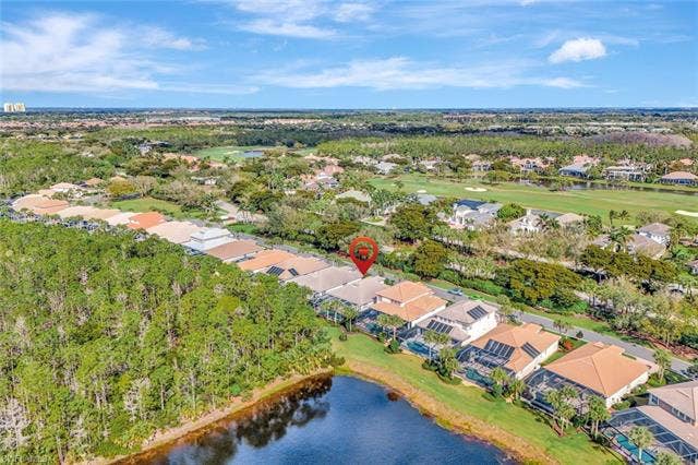 9375 Oak Strand Dr, Estero, FL 34135 Drone / aerial view with a residential view, a water view, and golf course view
