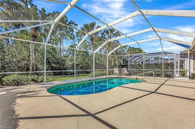 9375 Oak Strand Dr, Estero, FL 34135 Pool with a patio and glass enclosure