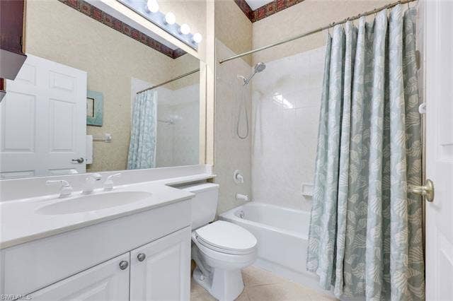 9375 Oak Strand Dr, Estero, FL 34135 Bathroom with toilet, shower / bath combo, and vanity