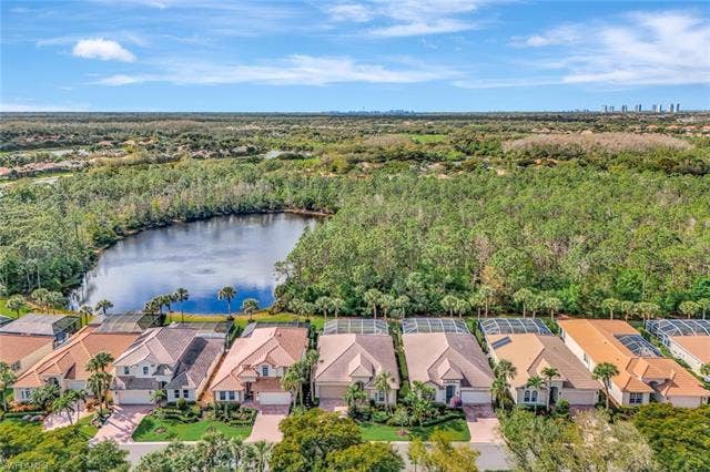 9375 Oak Strand Dr, Estero, FL 34135 Aerial view featuring a residential view, a water view, and a forest view
