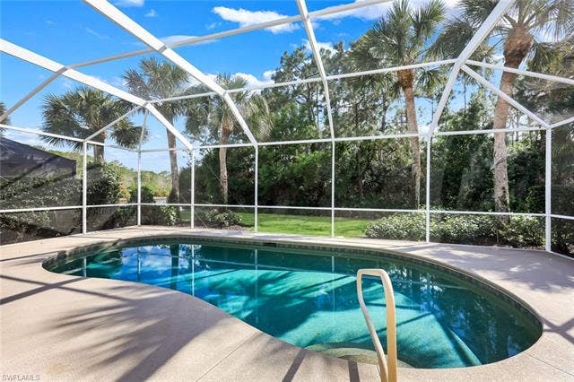 9375 Oak Strand Dr, Estero, FL 34135 Pool featuring a lanai and a patio area