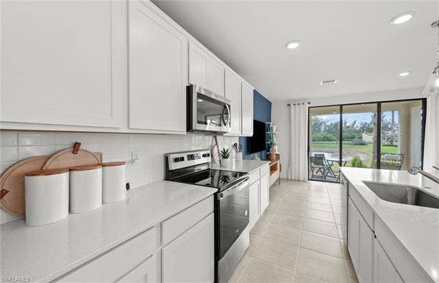 1558 Lake Jessup Cir, Cape Coral, FL 33909 Rowan staged Model.