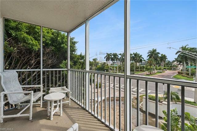 5500 Bonita Beach Rd, #308, Bonita Springs, FL 34134 Screened balcony with concrete flooring and metal railings
