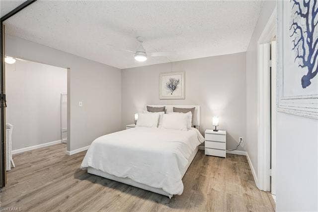 5500 Bonita Beach Rd, #308, Bonita Springs, FL 34134 Wood-finish flooring with light gray wall tones and a ceiling fan