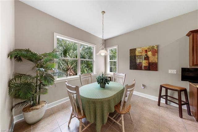 26485 Lucky Stone Rd, #202, Bonita Springs, FL 34135 Tile flooring and multiple windows with white trim