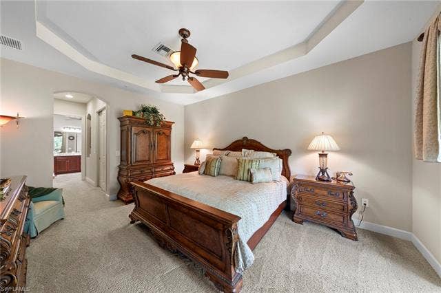 26485 Lucky Stone Rd, #202, Bonita Springs, FL 34135 Tray ceiling with a ceiling fan