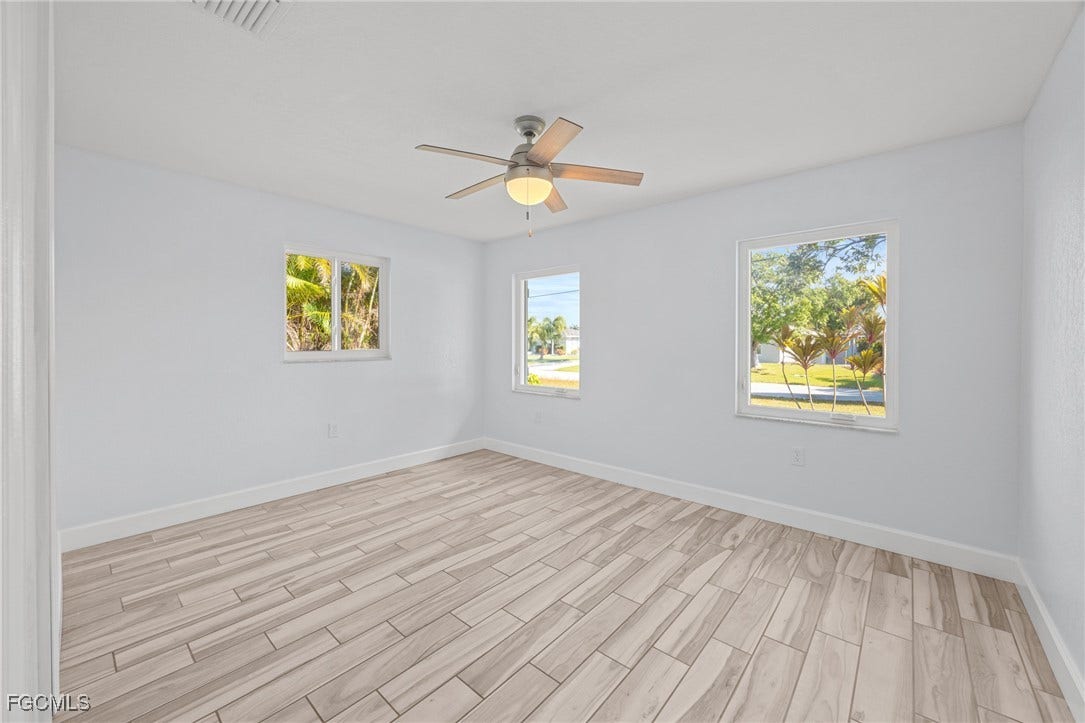 2514 SE 26th Avenue, Cape Coral, FL 33904 Spare room with wood tiled floors and ceiling fan