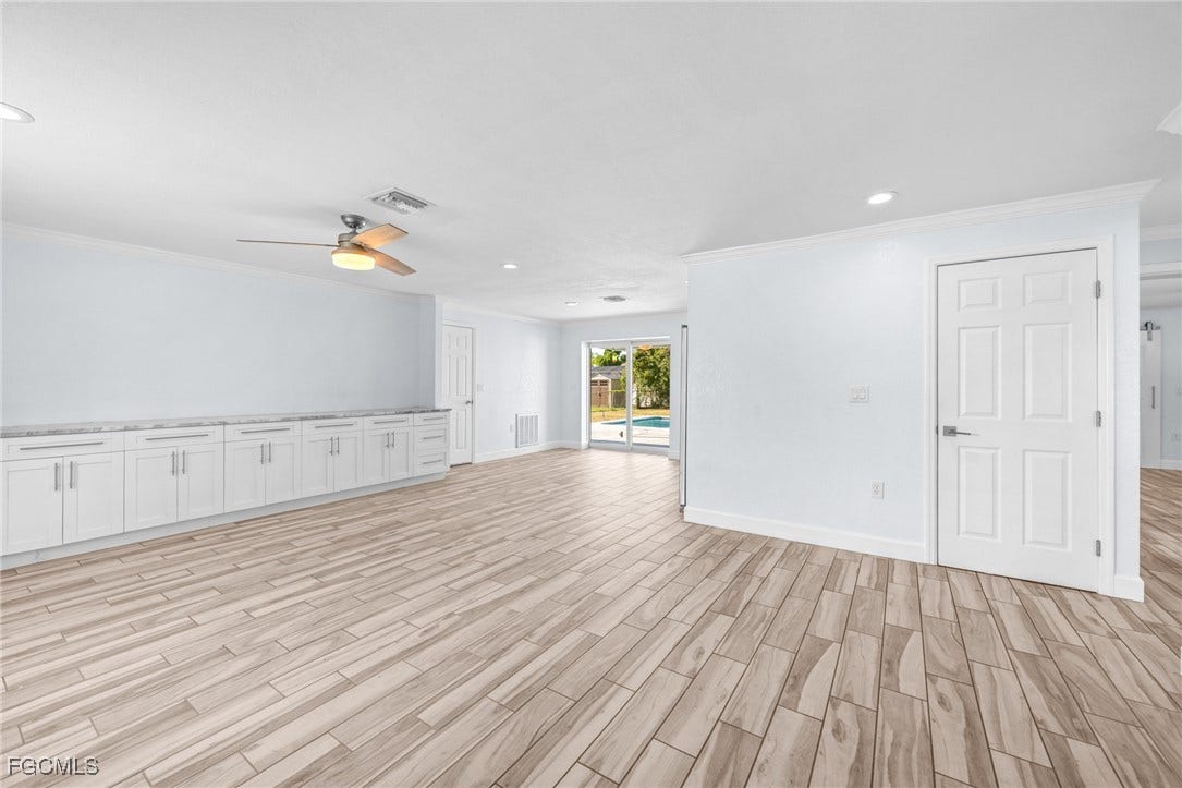 2514 SE 26th Avenue, Cape Coral, FL 33904 Unfurnished room featuring recessed lighting, crown molding, light wood-style flooring, and ceiling fan