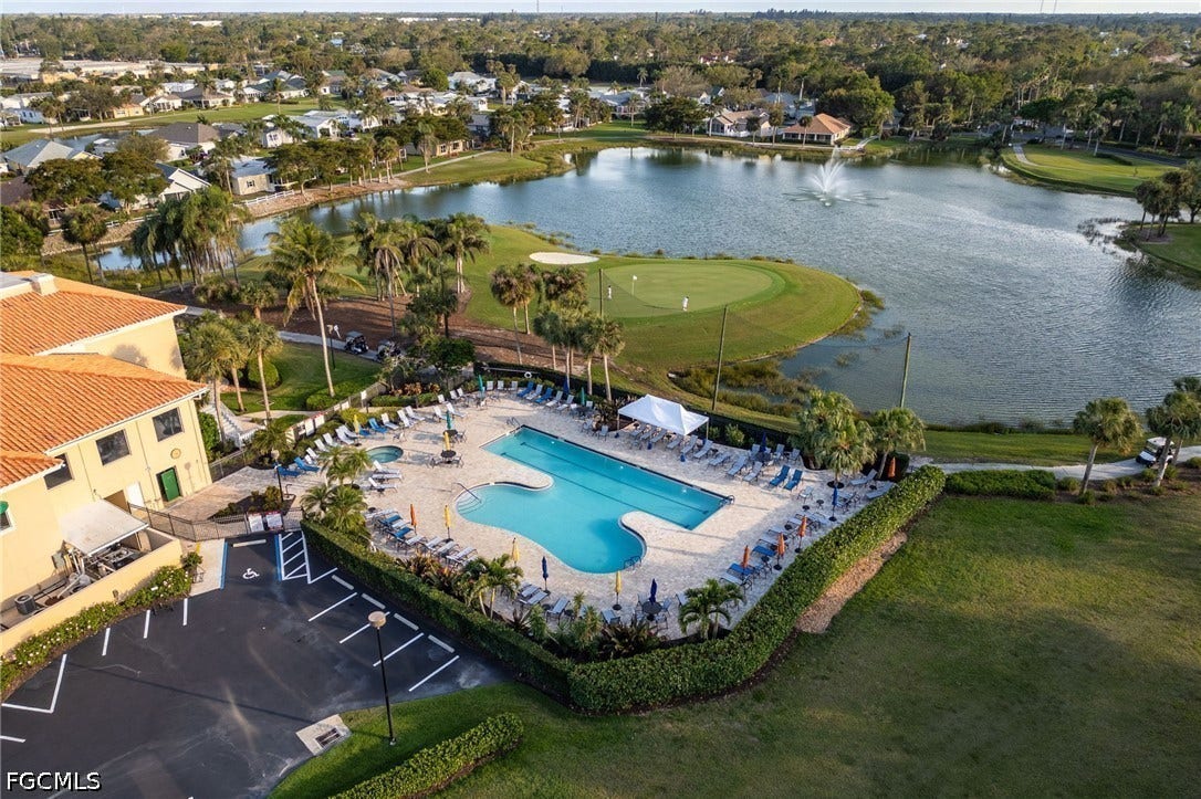 26600 ROSEWOOD POINTE Drive, #B-105, Bonita Springs, FL 34135 Drone / aerial view featuring golf course view and a water view