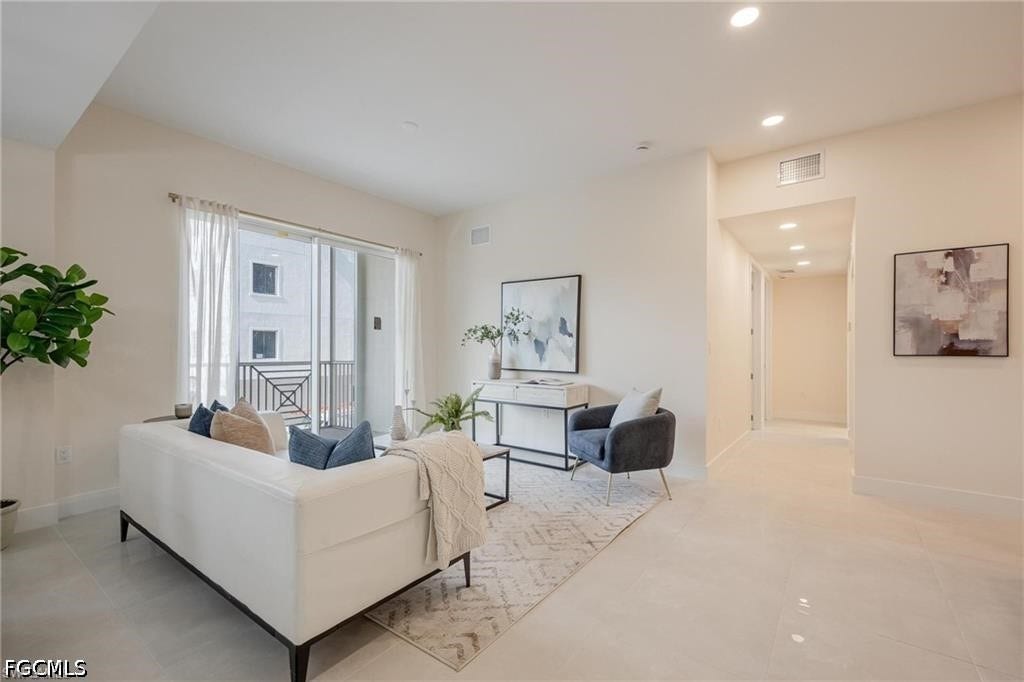 26600 ROSEWOOD POINTE Drive, #B-105, Bonita Springs, FL 34135 Living area featuring baseboards, visible vents, and recessed lighting