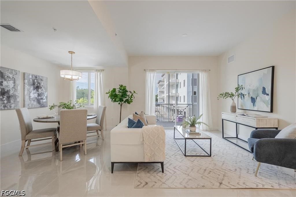 26600 ROSEWOOD POINTE Drive, #B-105, Bonita Springs, FL 34135 Living area with baseboards, visible vents, and light tile patterned floors