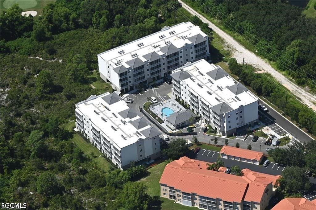 26600 ROSEWOOD POINTE Drive, #B-105, Bonita Springs, FL 34135 Bird's eye view with a wooded view