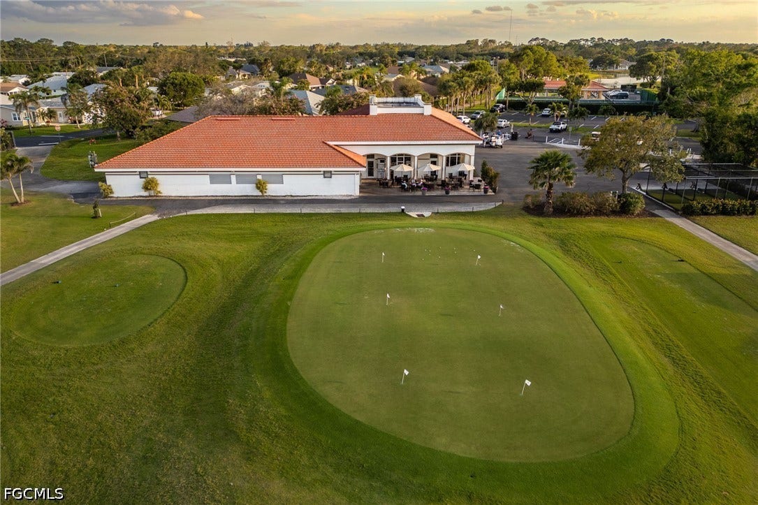 26600 ROSEWOOD POINTE Drive, #B-105, Bonita Springs, FL 34135 Aerial view at dusk featuring view of golf course