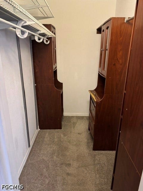 Plush gray carpeting and white painted walls