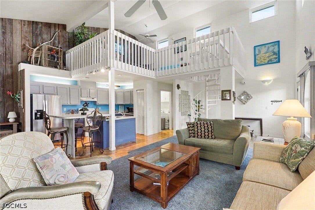 BLUE BAYOU A:  MAIN LIVING AREA.  DECORATIVE GLASS BLOCK BRINGS LIGHT IN TO HALLWAY. BEDROOMS ARE  THROUGH THAT HALLWAY.  CARPETED LIVING AREA.