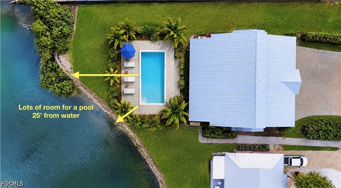 EXPANSIVE PROPERTY FEATURING A WATERFRONT EDGE, MANICURED LAWN AND MATURE LANDSCAPING. (NO POOL CURRENTLY.  VIRTUAL POOL IS ONLY TO SHOW THE POSSIBILITIES!)