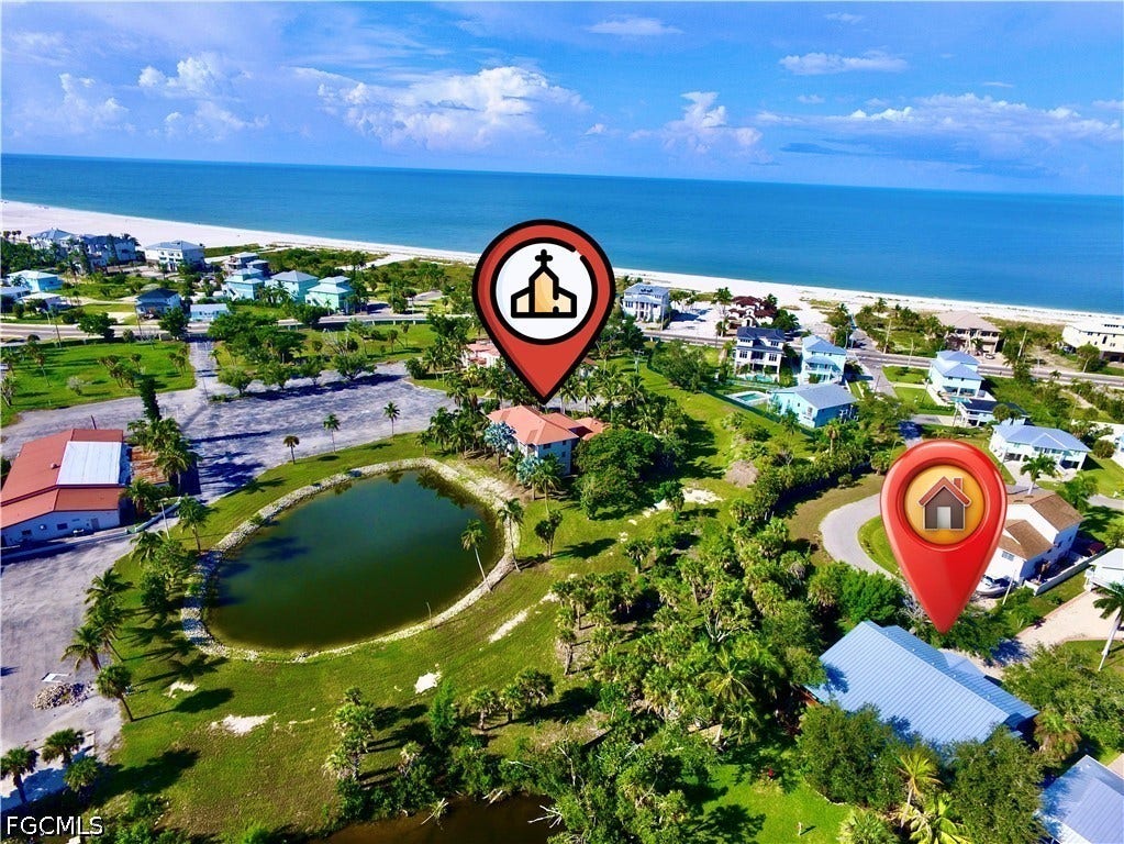 AERIAL VIEW SHOWING PROXIMITY TO BEACH AS WELL AS TO NEIGHBORING CATHOLIC CHURCH PROPERTY