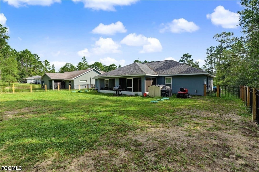 9342/9344 N Peachtree Way, Citrus Springs, FL 34434 Expansive rear yard with a perimeter fence and mature trees