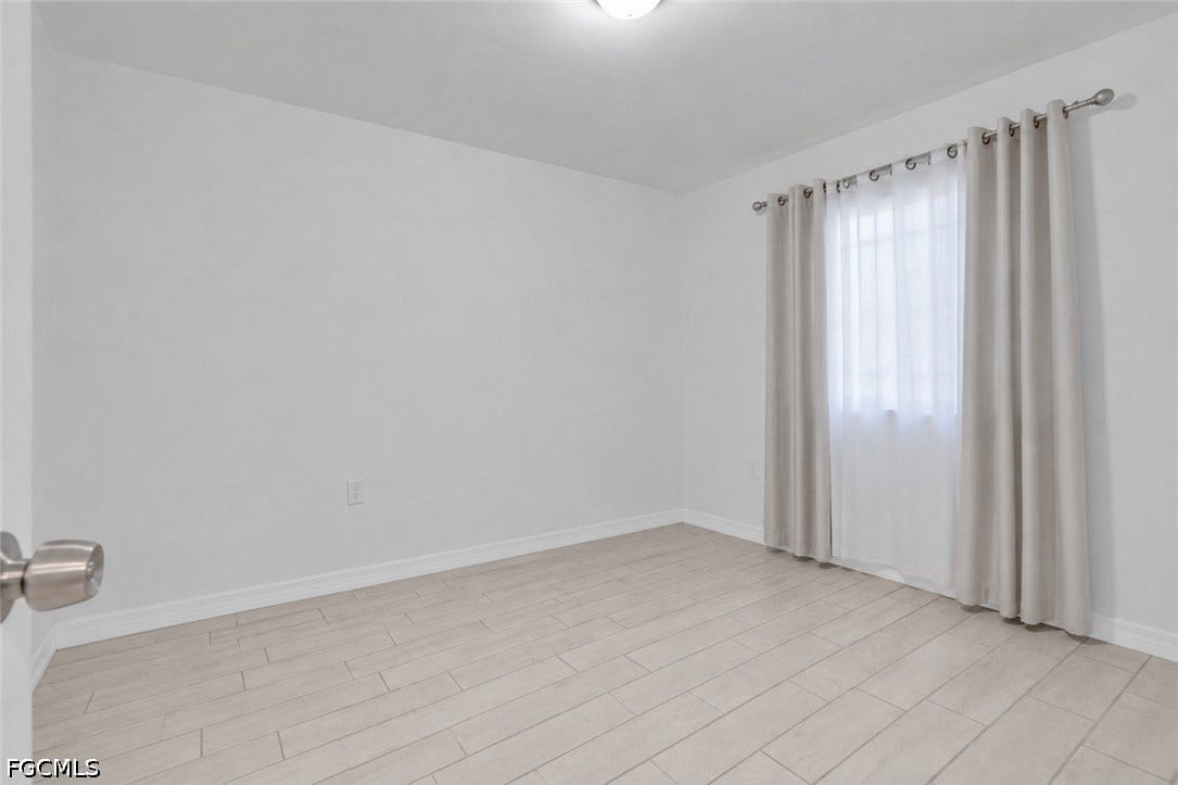 2412/2414 Richard Avenue S, Lehigh Acres, FL 33973 Neutral wall finishes and tile flooring