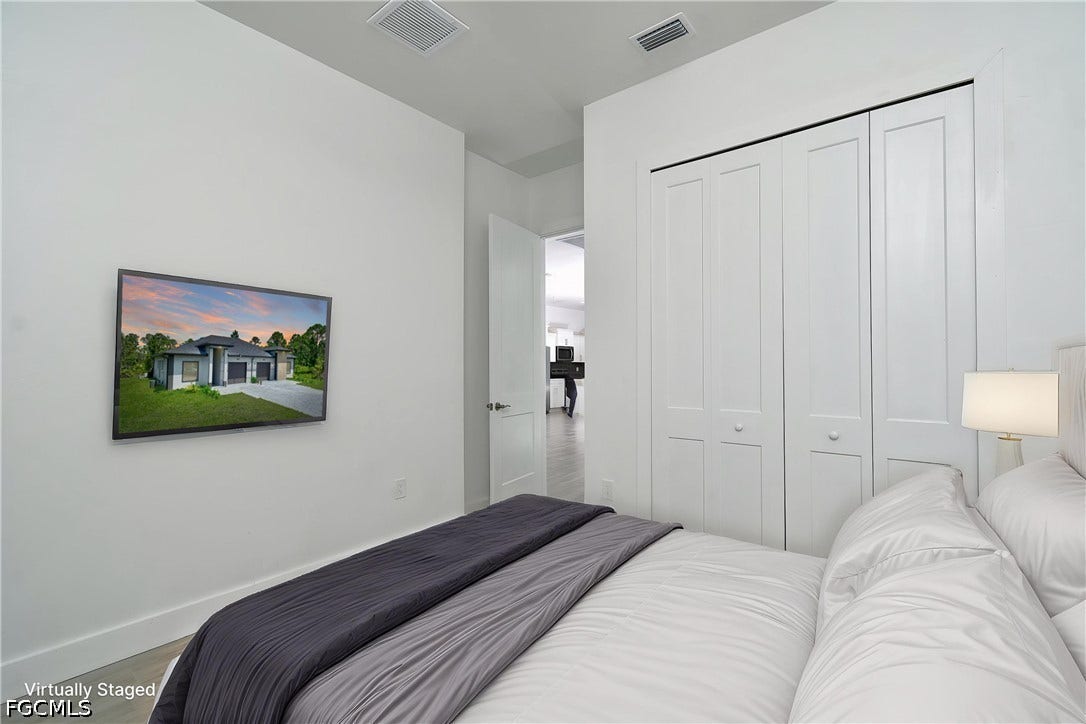 Bedroom featuring a closet and wood finished floors