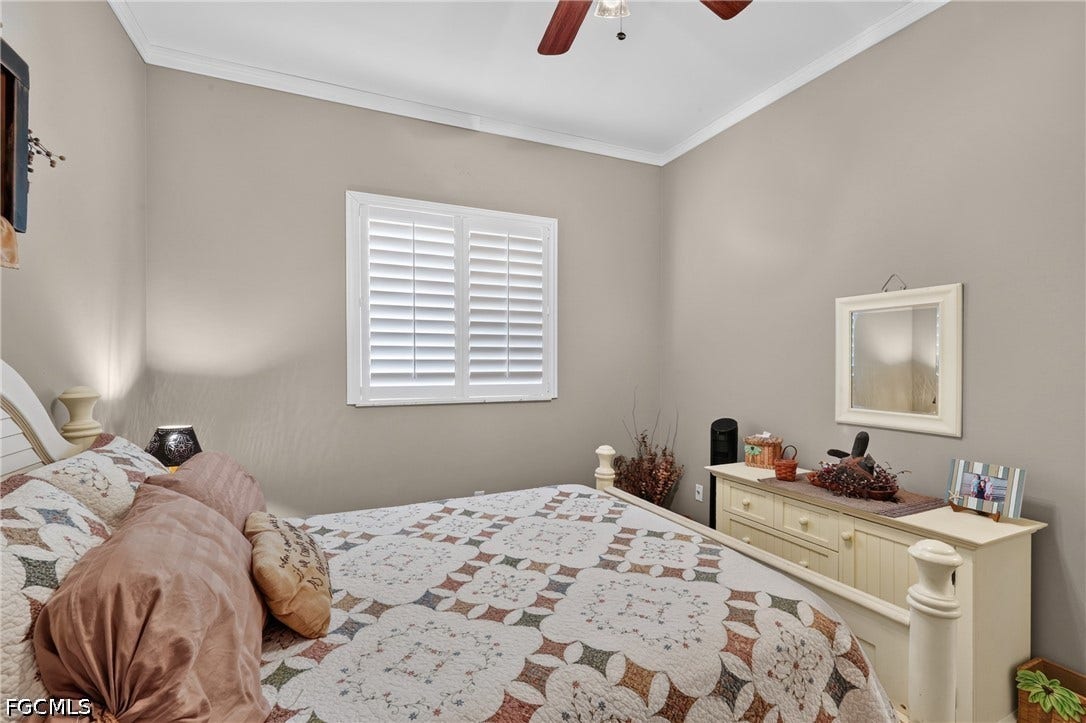 1416 SW 49th Terrace, Cape Coral, FL 33914 Guest bedroom 2- Wall-mounted ceiling fan, crown molding, and plantation shutters
