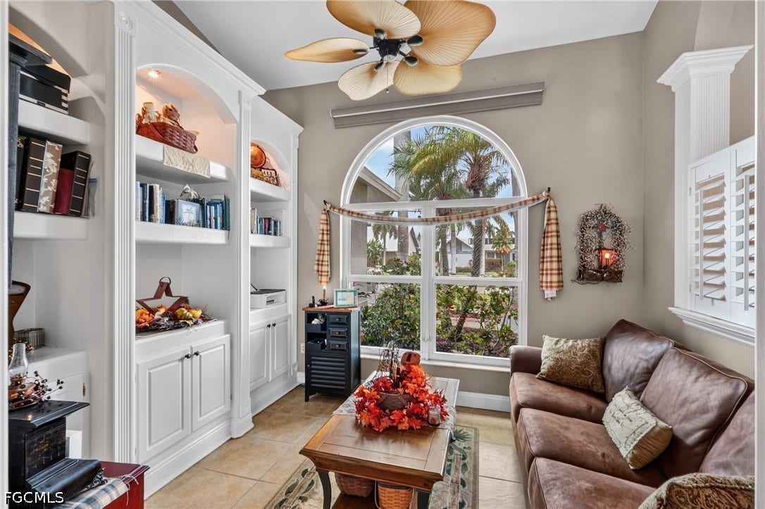 1416 SW 49th Terrace, Cape Coral, FL 33914 Built-in custom cabinetry with arched details, recessed lighting, and integrated storage
