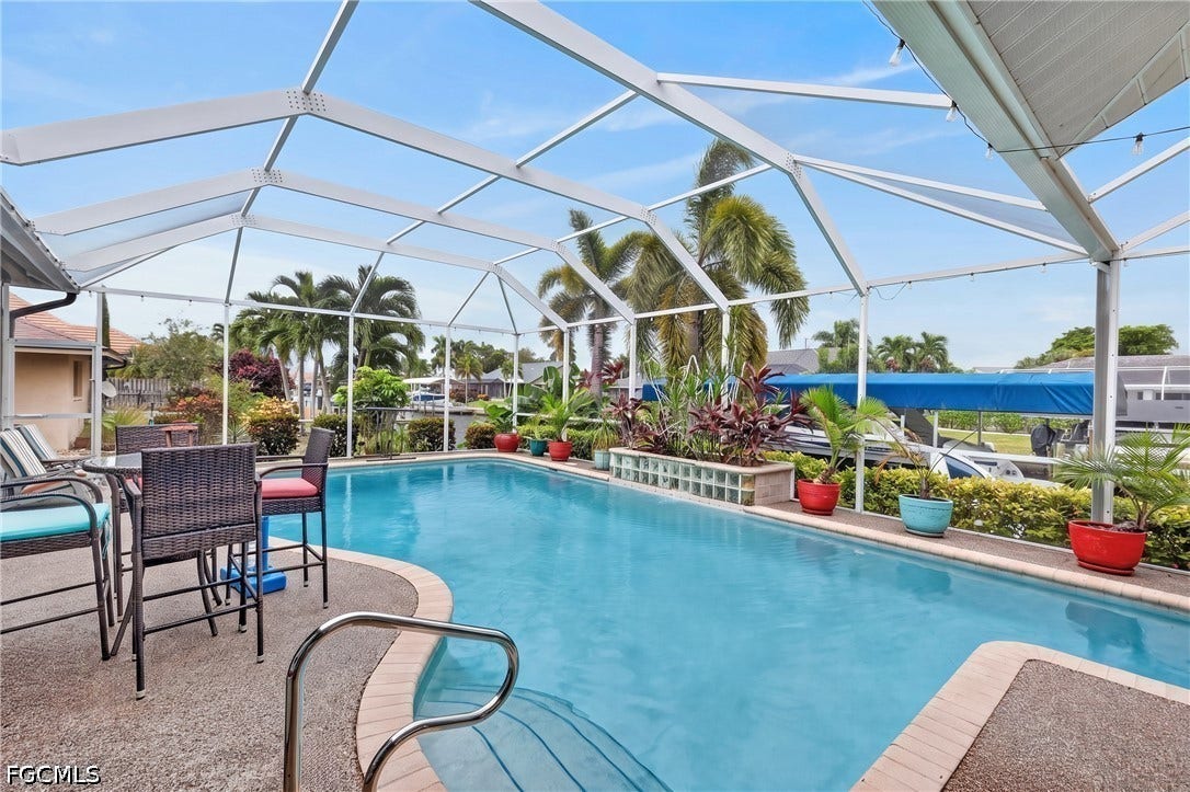 1416 SW 49th Terrace, Cape Coral, FL 33914 Heated and Screened-in swimming pool with an integrated patio and ample deck space