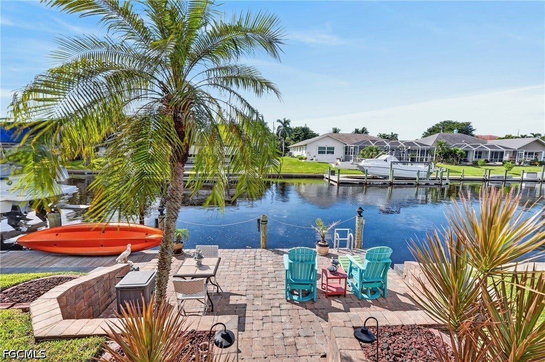 1416 SW 49th Terrace, Cape Coral, FL 33914 Brick paver patio and retaining wall with direct canal access