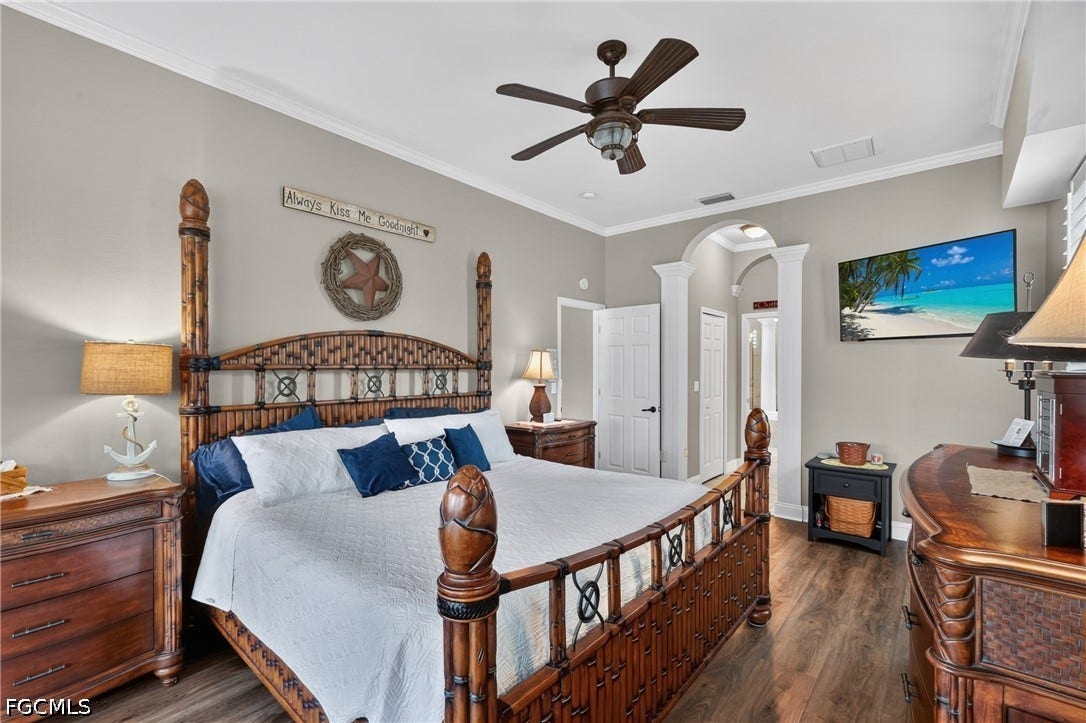 1416 SW 49th Terrace, Cape Coral, FL 33914 Wood-finish flooring with crown molding and ceiling fan