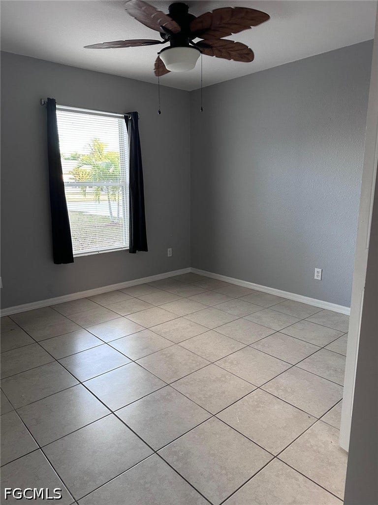 2926 SE Santa Barbara Place, Cape Coral, FL 33904 Recessed window with blinds, ceiling fan, and tile flooring