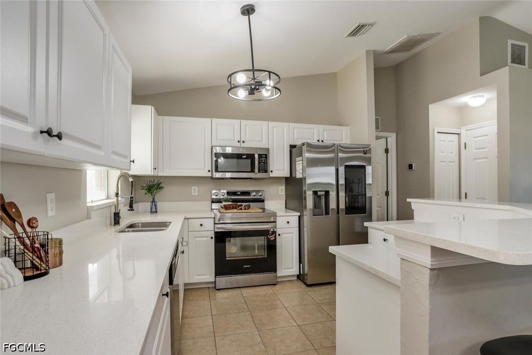 2241 NW 2nd Avenue, Cape Coral, FL 33993 New quartz countertops!