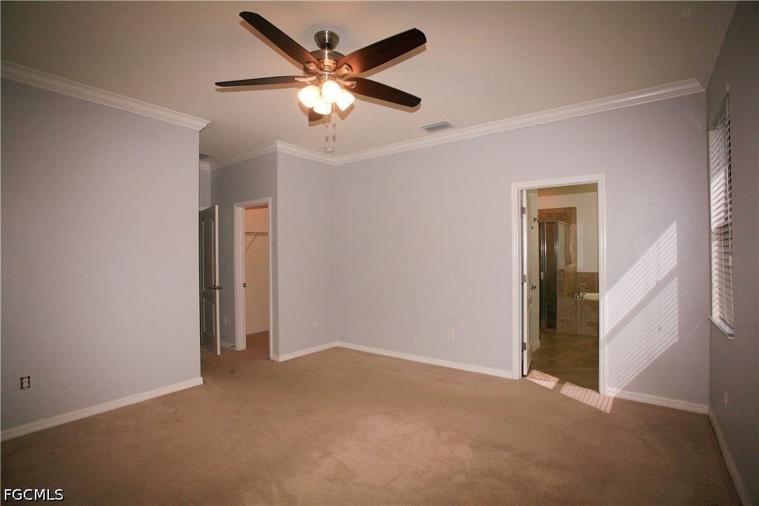 14495 Vindel Circle, Fort Myers, FL 33905 Carpeted room with crown molding, ceiling fan, and window with blinds