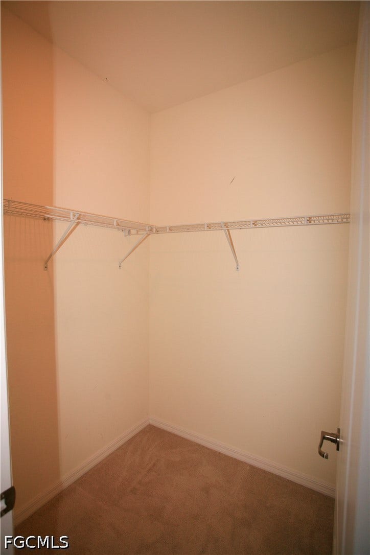 14495 Vindel Circle, Fort Myers, FL 33905 Wall-to-wall carpeting and an integrated wire shelving system