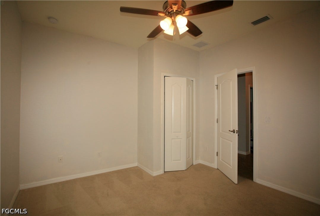 14495 Vindel Circle, Fort Myers, FL 33905 Neutral wall tones, recessed lighting, and a ceiling fan with integrated light fixture