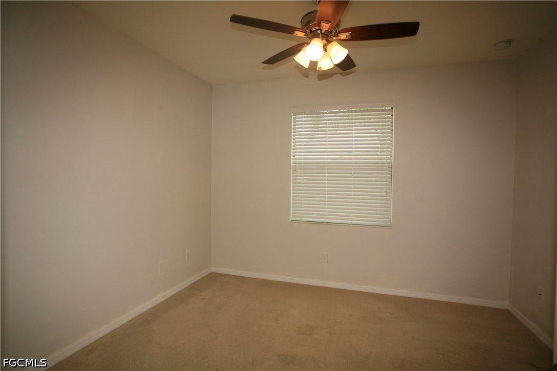 14495 Vindel Circle, Fort Myers, FL 33905 Carpeted flooring, window with blinds, ceiling fan with integrated lighting, and neutral wall paint