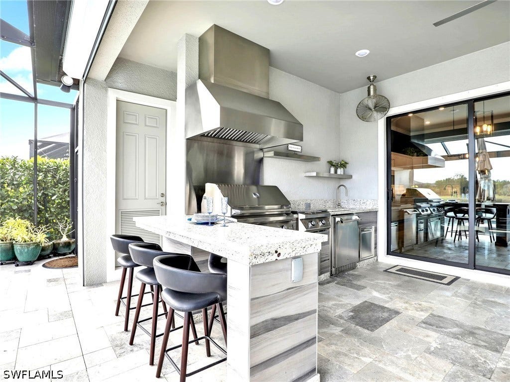 Outdoor Kitchen with Convenient Pool Bath & Outdoor Storage