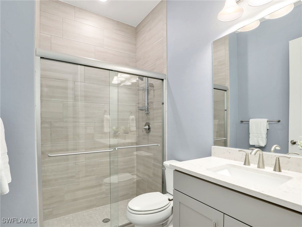 Guest Bath 2 with upgraded shower and tiles to the ceiling