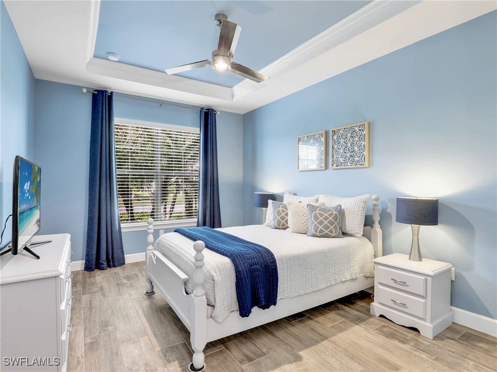 Guest Bedroom 1 with adjacent guest bath and pocket doors for a more ensuite privacy